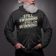 Masters Swimmer Still Swimming Competing Winning Adult Zip Up Hoodie Masters Swimmer Still Swimming Competing Winning Adult Zip Up Hoodie