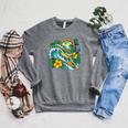 Green Sea Turtle Surfs Past a Canoe Paddle Sleeveless Raglan Sleeve Sweatshirt Deep Heather