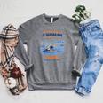 Swimming Never Underestimate A Woman Swim In Her Seventies Raglan Sleeve Sweatshirt Deep Heather Swimming Never Underestimate A Woman Swim In Her Seventies Raglan Sleeve Sweatshirt Deep Heather