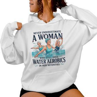 Never Underestimate A Woman Water Aerobics In Her Seventies Women Hoodie - Thegiftio UK