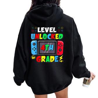 First Day Of 4Th Grade Level Unlocked Game Back To School Women Oversized Hoodie Back Print - Thegiftio UK
