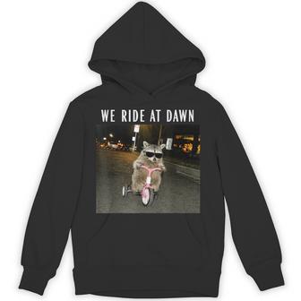 Racoon We Ride At Dawn Riding Tricycle Chaotic Meme Hoodie - Thegiftio UK