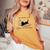Life Is Better With Books Cats And Coffee レディースオーバーサイズコンフォートTシャツ Mustard Life Is Better With Books Cats And Coffee レディースオーバーサイズコンフォートTシャツ Mustard