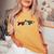 トラウト 魚 シルエット 花 ボタニカル フローラル レディースオーバーサイズコンフォートTシャツ Mustard