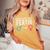 男性から女性へのトランスジェンダーlgbt レディースオーバーサイズコンフォートTシャツ Mustard 男性から女性へのトランスジェンダーlgbt レディースオーバーサイズコンフォートTシャツ Mustard