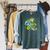 Green Sea Turtle Surfs Past a Canoe Paddle Sleeveless Raglan Sleeve Sweatshirt Heather Blue Lagoon