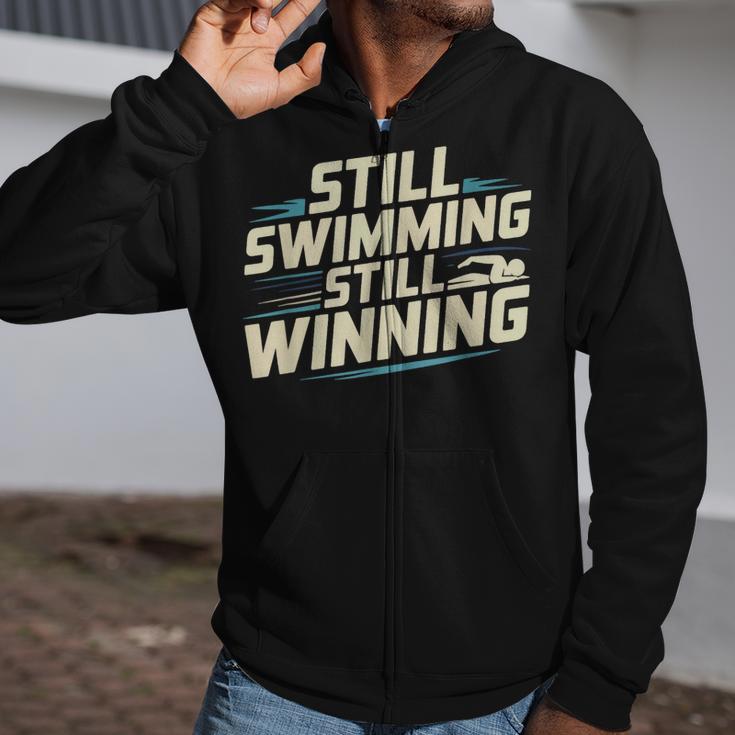 Masters Swimmer Still Swimming Competing Winning Adult Zip Up Hoodie Masters Swimmer Still Swimming Competing Winning Adult Zip Up Hoodie