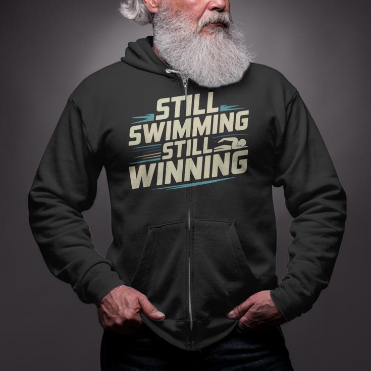 Masters Swimmer Still Swimming Competing Winning Adult Zip Up Hoodie Masters Swimmer Still Swimming Competing Winning Adult Zip Up Hoodie
