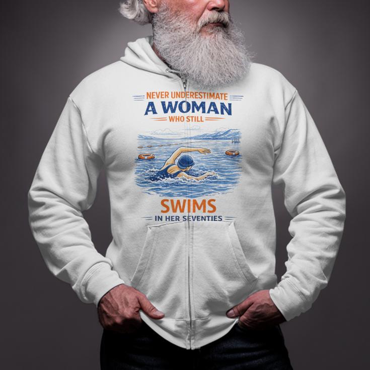 Swimming Never Underestimate A Woman Swim In Her Seventies Zip Up Hoodie Swimming Never Underestimate A Woman Swim In Her Seventies Zip Up Hoodie