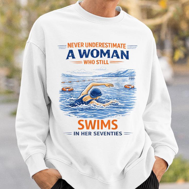 Swimming Never Underestimate A Woman Swim In Her Seventies Sweatshirt Gifts for Him Swimming Never Underestimate A Woman Swim In Her Seventies Sweatshirt Gifts for Him