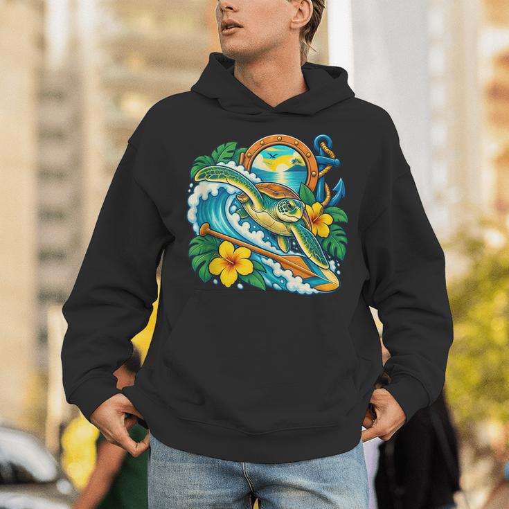 Green Sea Turtle Surfs Past a Canoe Paddle Sleeveless Unisex Hoodie