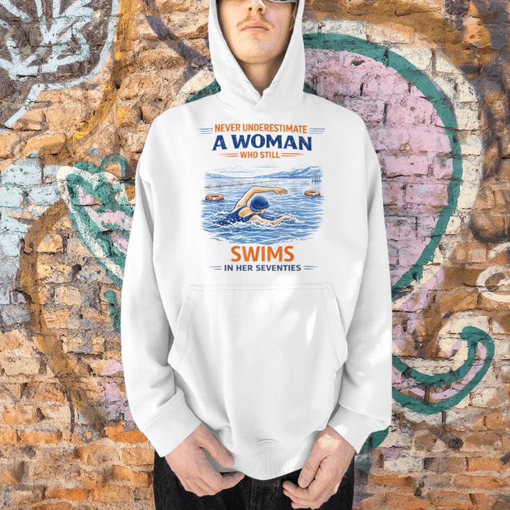 Swimming Never Underestimate A Woman Swim In Her Seventies Men Hoodie Swimming Never Underestimate A Woman Swim In Her Seventies Men Hoodie