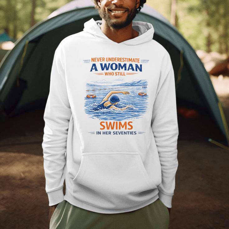 Swimming Never Underestimate A Woman Swim In Her Seventies Men Hoodie Swimming Never Underestimate A Woman Swim In Her Seventies Men Hoodie