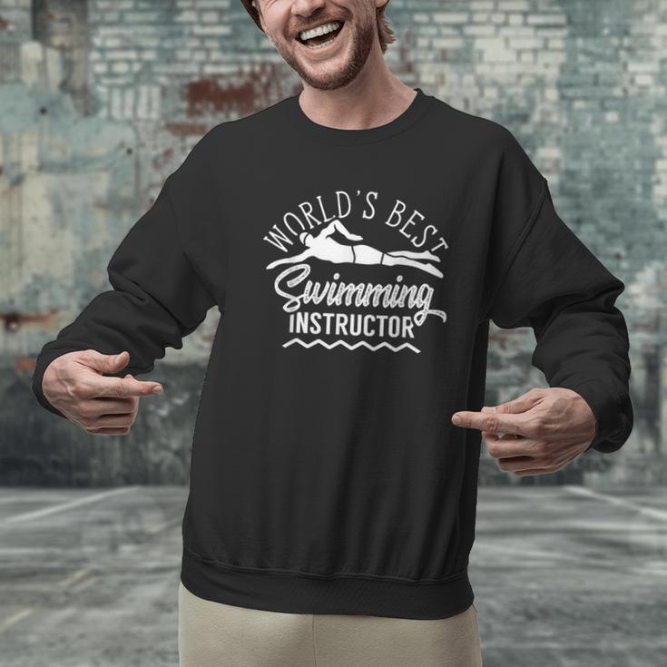 World's Best Swimming Instructor Teacher Coach Swim Men Women Kids Men Graphic Sweatshirt World's Best Swimming Instructor Teacher Coach Swim Men Women Kids Men Graphic Sweatshirt