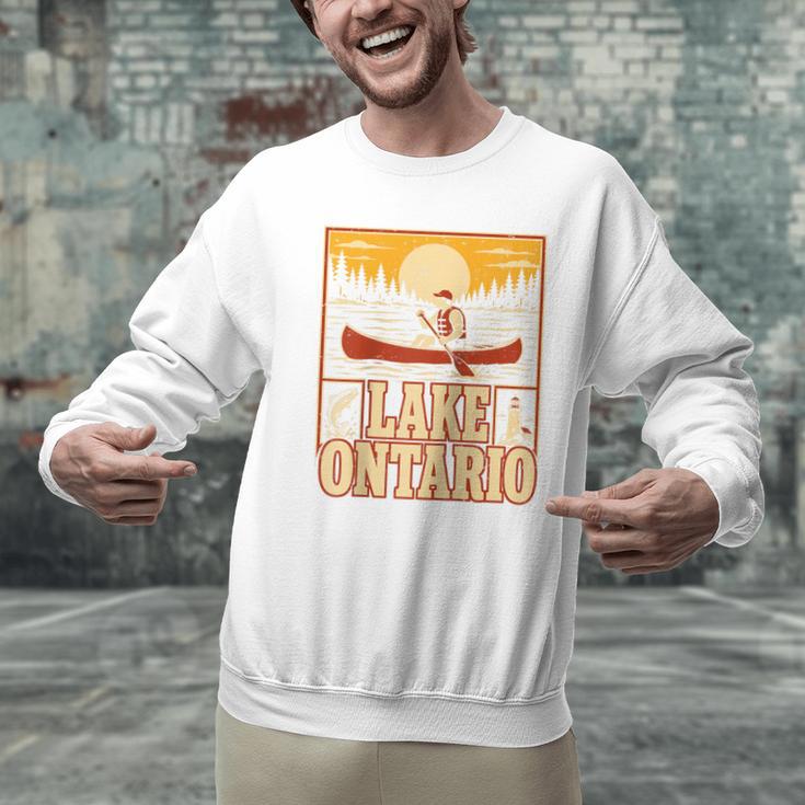 Lake Ontario Canoe Fishing Light House Sunset Retro Raglan Baseball Tee Men Graphic Sweatshirt Lake Ontario Canoe Fishing Light House Sunset Retro Raglan Baseball Tee Men Graphic Sweatshirt