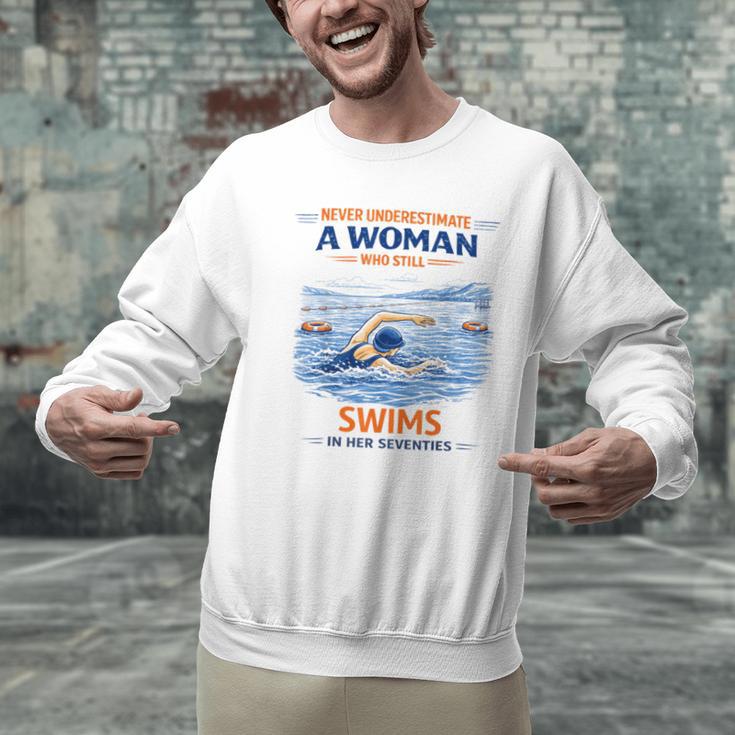 Swimming Never Underestimate A Woman Swim In Her Seventies Men Graphic Sweatshirt Swimming Never Underestimate A Woman Swim In Her Seventies Men Graphic Sweatshirt