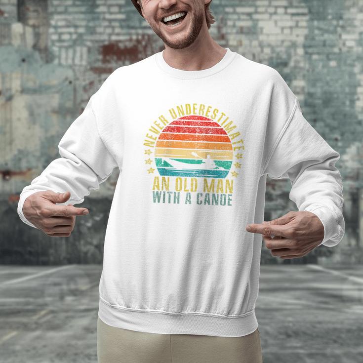 Never Underestimate An Old Man With a Canoe Retro Raglan Baseball Tee Men Graphic Sweatshirt