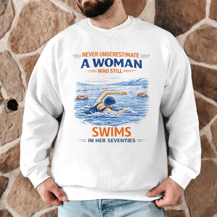 Swimming Never Underestimate A Woman Swim In Her Seventies Men Graphic Sweatshirt Swimming Never Underestimate A Woman Swim In Her Seventies Men Graphic Sweatshirt