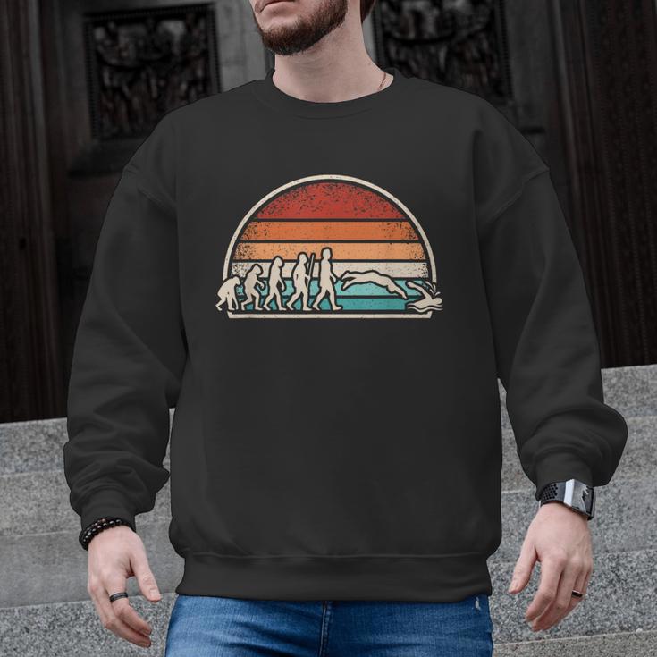 Swimming Evolution Retro Swim Swimmer Men Women Men Graphic Sweatshirt