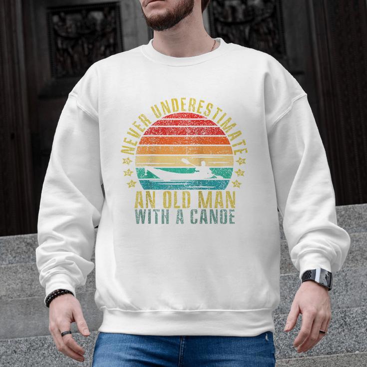 Never Underestimate An Old Man With a Canoe Retro Raglan Baseball Tee Men Graphic Sweatshirt