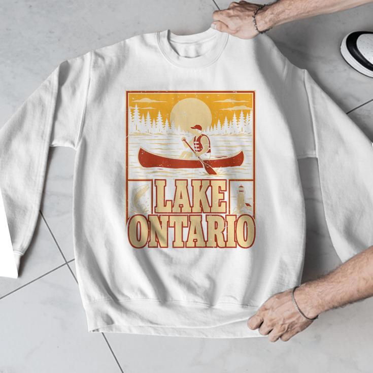 Lake Ontario Canoe Fishing Light House Sunset Retro Raglan Baseball Tee Men Graphic Sweatshirt Lake Ontario Canoe Fishing Light House Sunset Retro Raglan Baseball Tee Men Graphic Sweatshirt