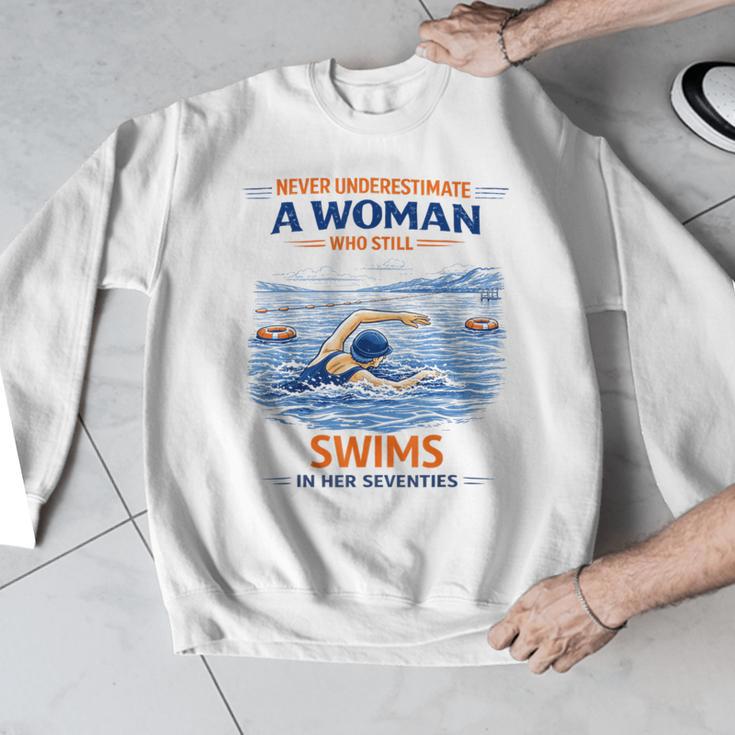 Swimming Never Underestimate A Woman Swim In Her Seventies Men Graphic Sweatshirt Swimming Never Underestimate A Woman Swim In Her Seventies Men Graphic Sweatshirt