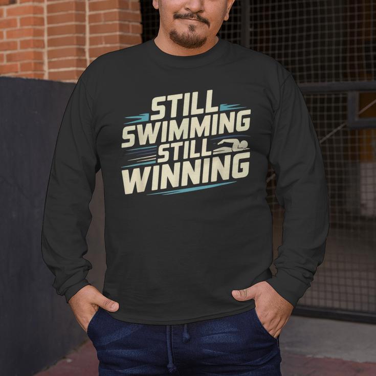 Masters Swimmer Still Swimming Competing Winning Adult Men's Long Sleeve T-Shirt Masters Swimmer Still Swimming Competing Winning Adult Men's Long Sleeve T-Shirt