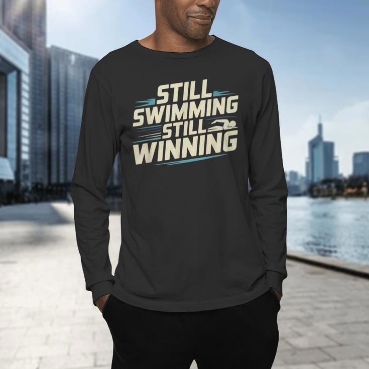 Masters Swimmer Still Swimming Competing Winning Adult Men's Long Sleeve T-Shirt Masters Swimmer Still Swimming Competing Winning Adult Men's Long Sleeve T-Shirt