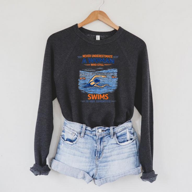 Swimming Never Underestimate A Woman Swim In Her Seventies Raglan Sleeve Sweatshirt Swimming Never Underestimate A Woman Swim In Her Seventies Raglan Sleeve Sweatshirt