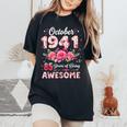 85歳 1941年10月 花柄 85歳 誕生日 男性 女性 レディースオーバーサイズコンフォートTシャツ Black